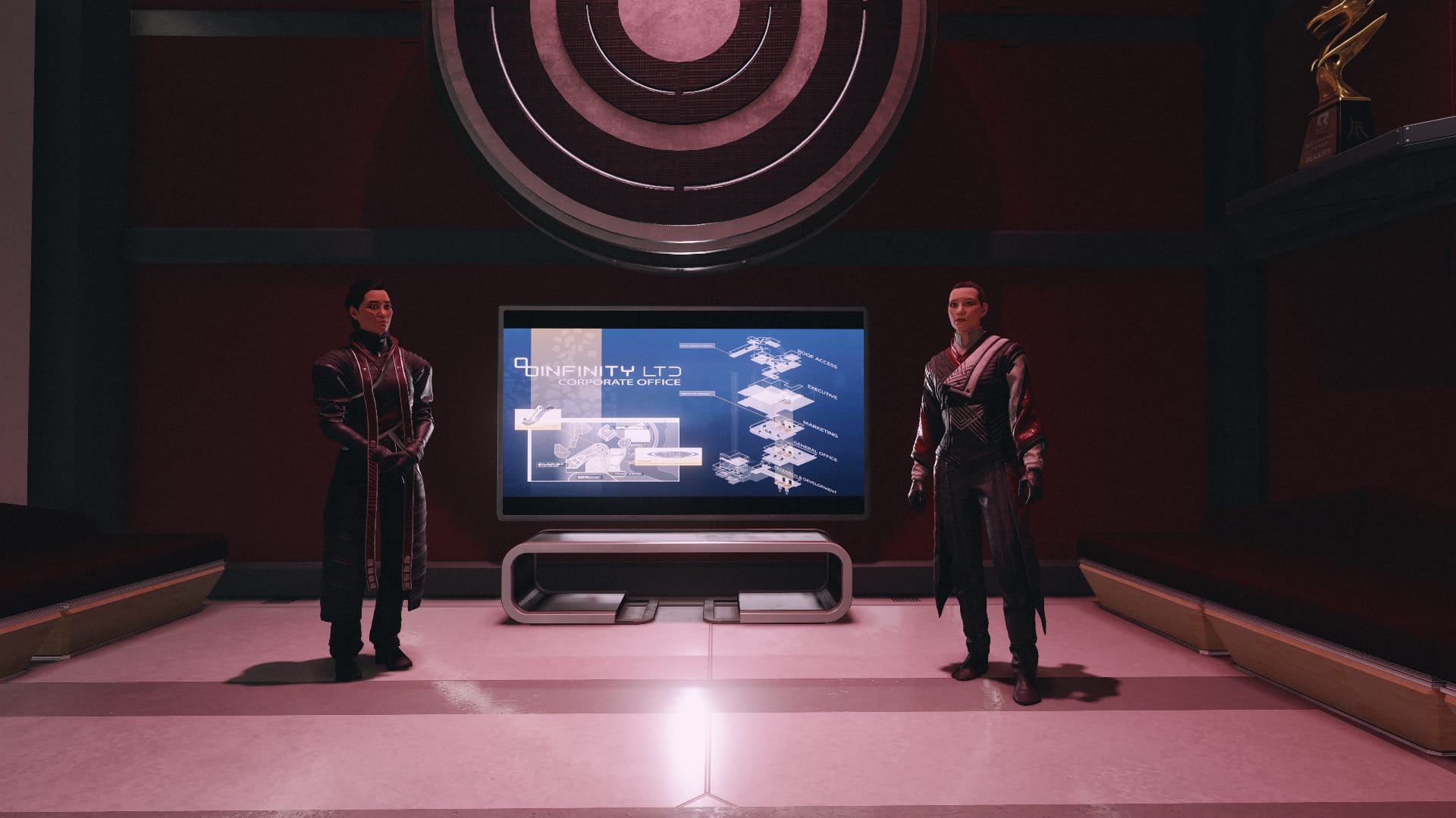 Starfield screenshot of Masako and Ularu standing on either side of a screen that says Infinity LTD.