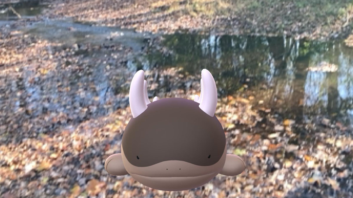 A Pokémon GO screenshot of Clodsire near a creek.