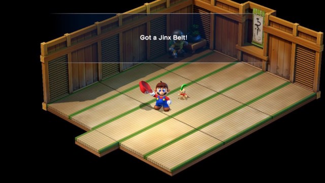 A Super Mario RPG screenshot of Mario receiving the Jinx Belt.