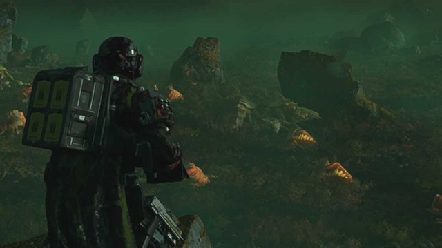 Helldivers 2 screenshot of a character looking out over rocky terrain crawling with bugs