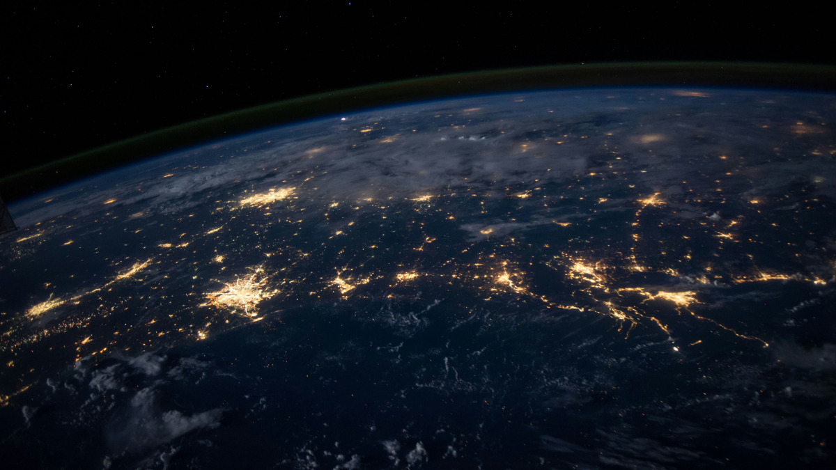 A photograph of cities at night from above the Earth.